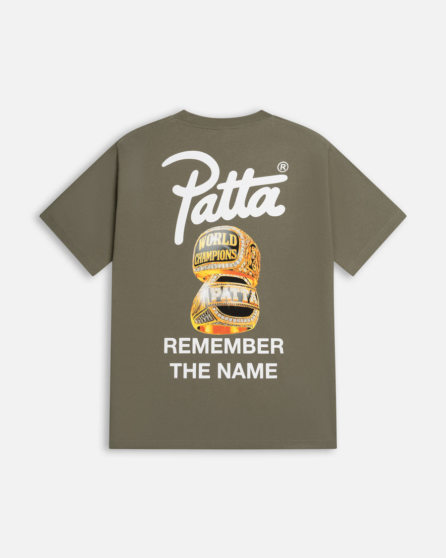 Back view of dusty olive Patta Championship t-shirt with championship rings graphic and script logo.