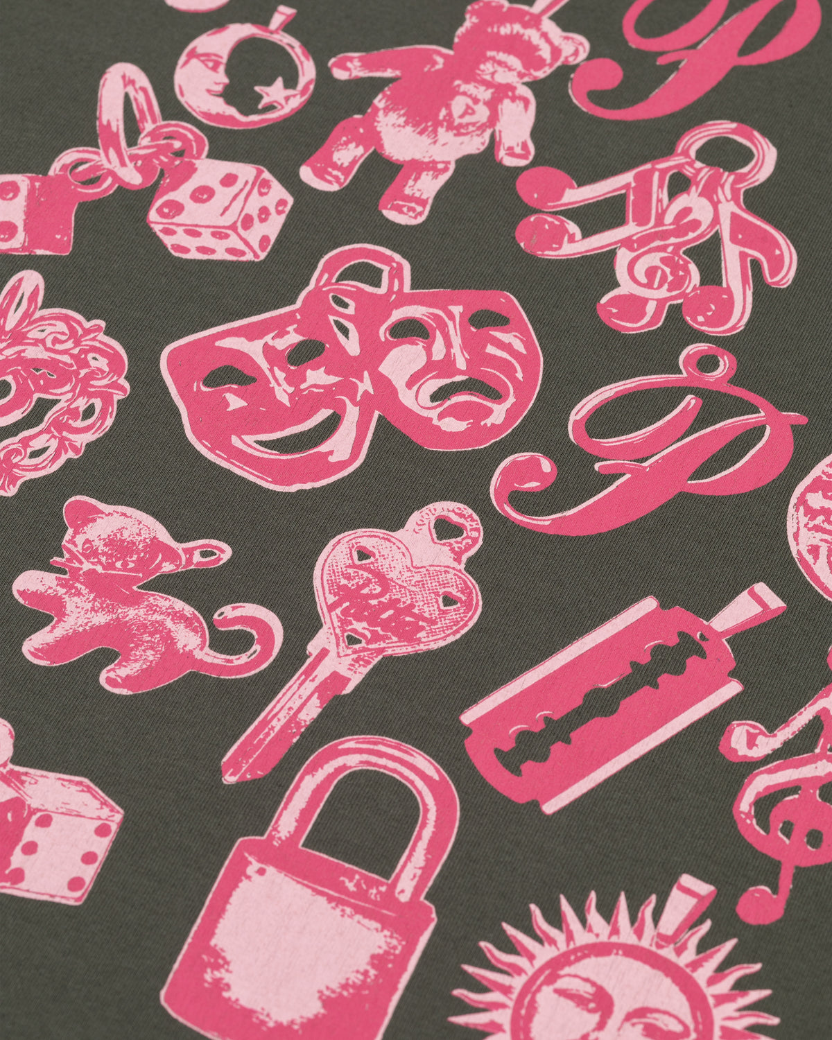 Close-up of the pink charms artwork printed on the Patta Kids Charm T-Shirt in Climbing Ivy.